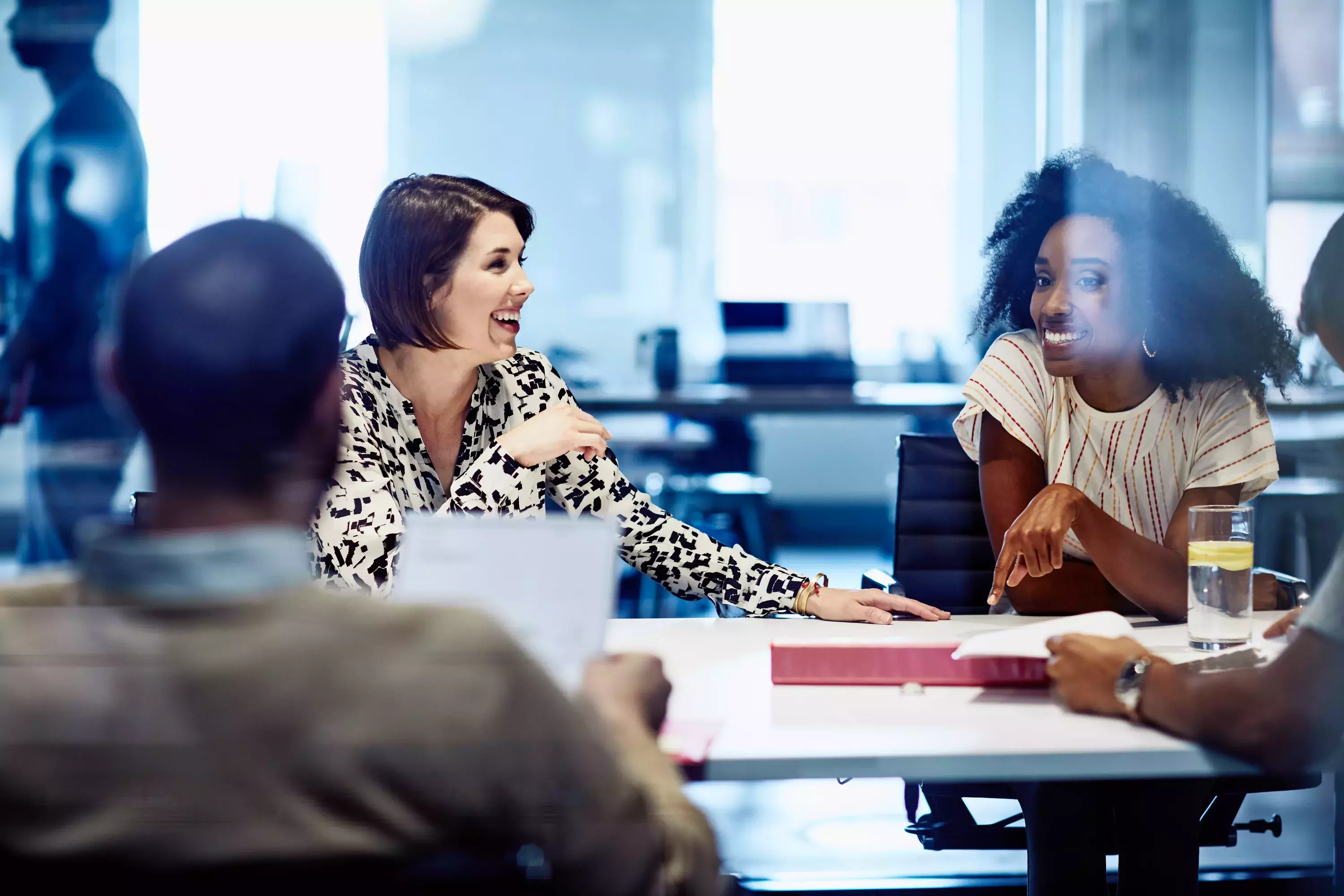 Smiling female in meeting at the office.